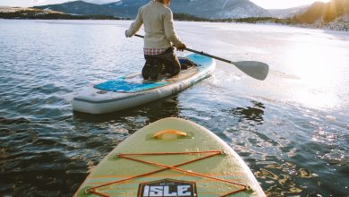 people on Isle inflatable paddle boards